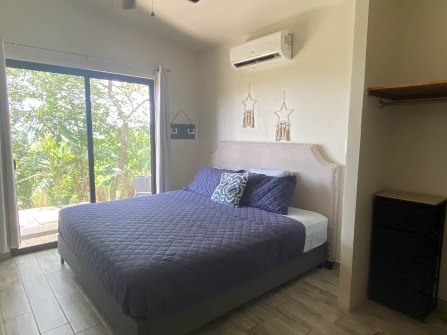 The bedroom at Casa Lunax, opening to the green