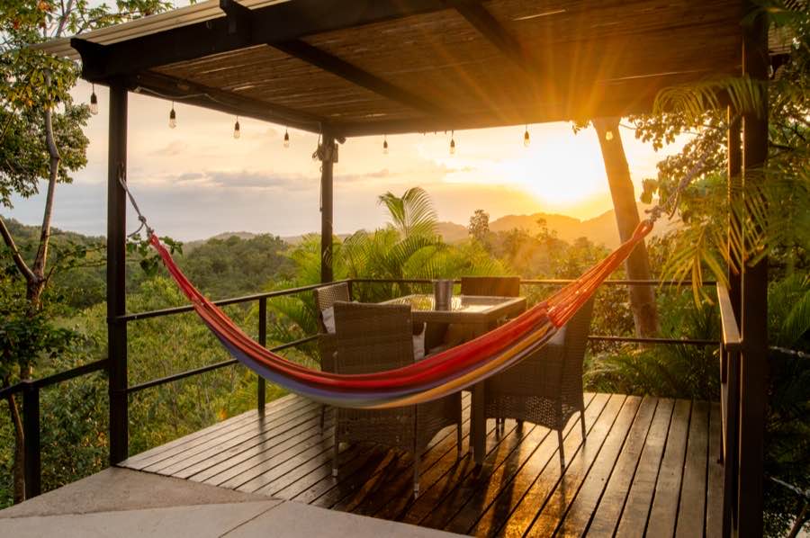 The hammock deck at Casa Sol at sunset, looking out over the hills